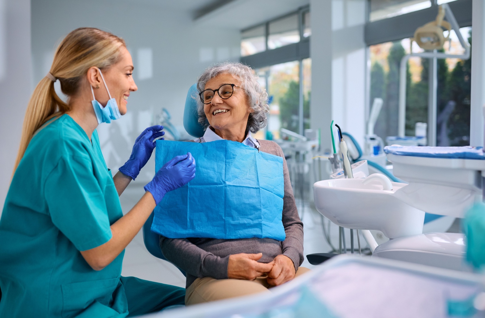 A senior patient getting a routine teeth cleaning